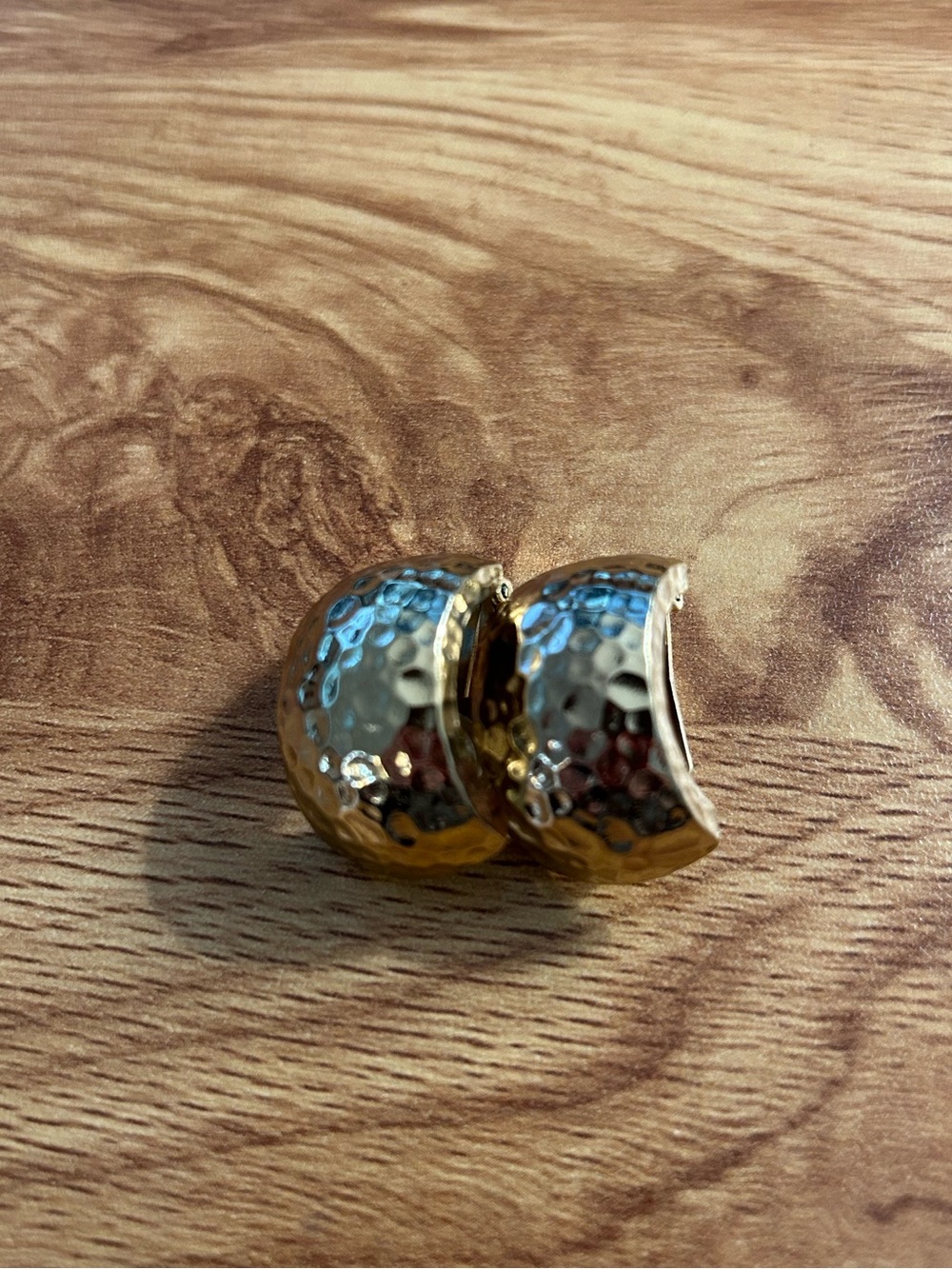 Authentic vintage Christian Dior hammered gold-toned dome clip-on earrings.